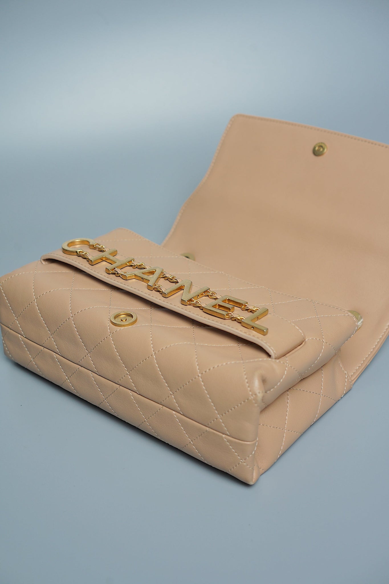 Chanel Logo Quilted Flap in Dark Beige Ghw
