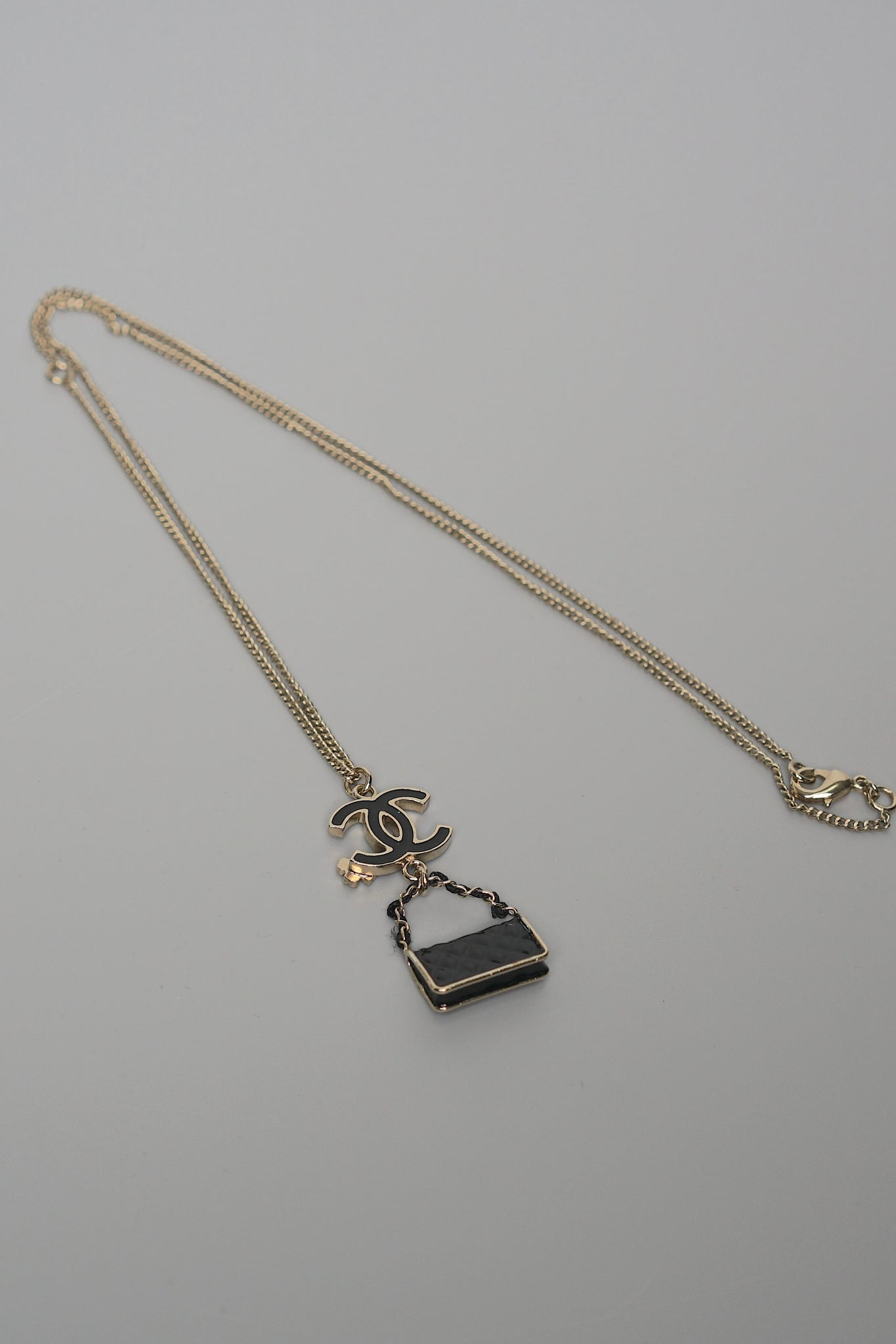 Chanel CC Bag Charm Necklace in Black Gold